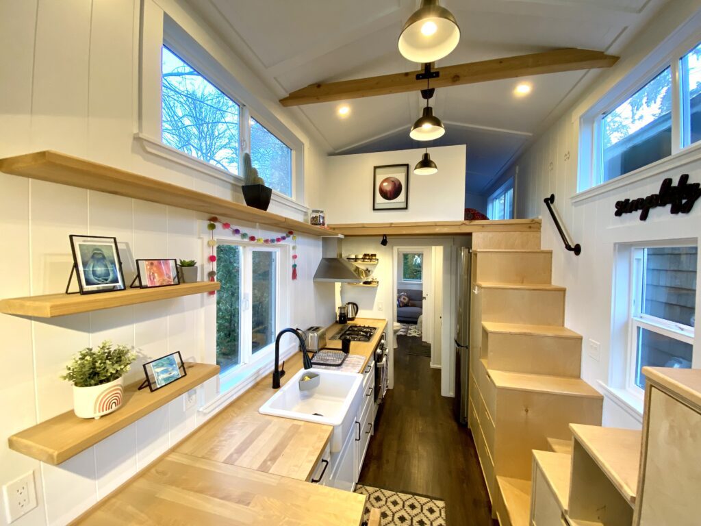 Tiny home requiring stair cabinetry, storage couch and living room shelving.
